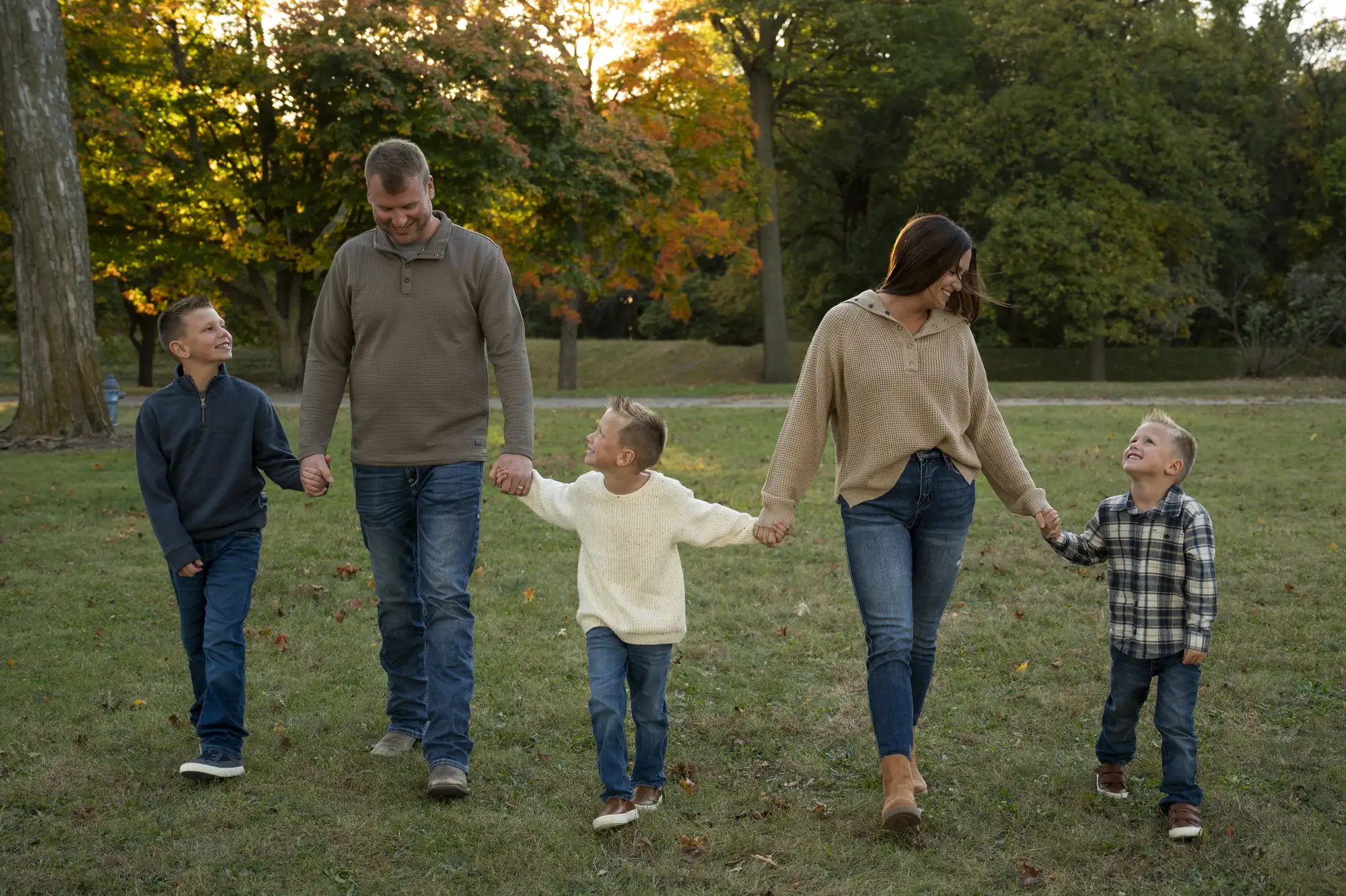 Fall family photos in the Cedar Valley, walking hand in hand through the park