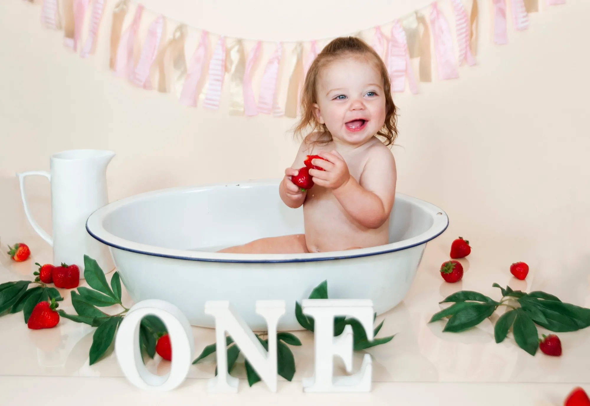 First birthday splash bath in the Cedar Valley, strawberries and a vintage tub