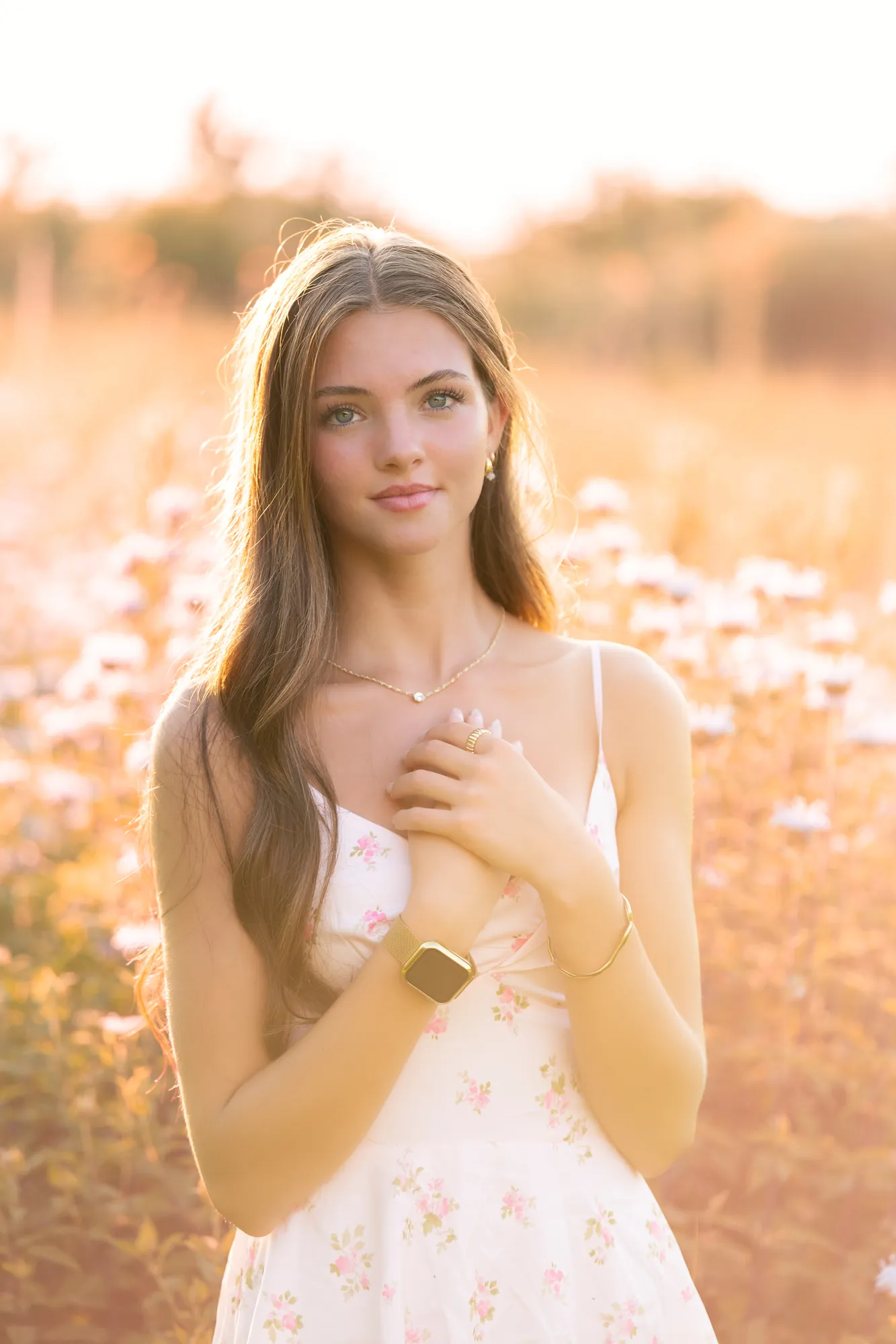 Senior pictures in the Cedar Valley, backlit field and floral dress