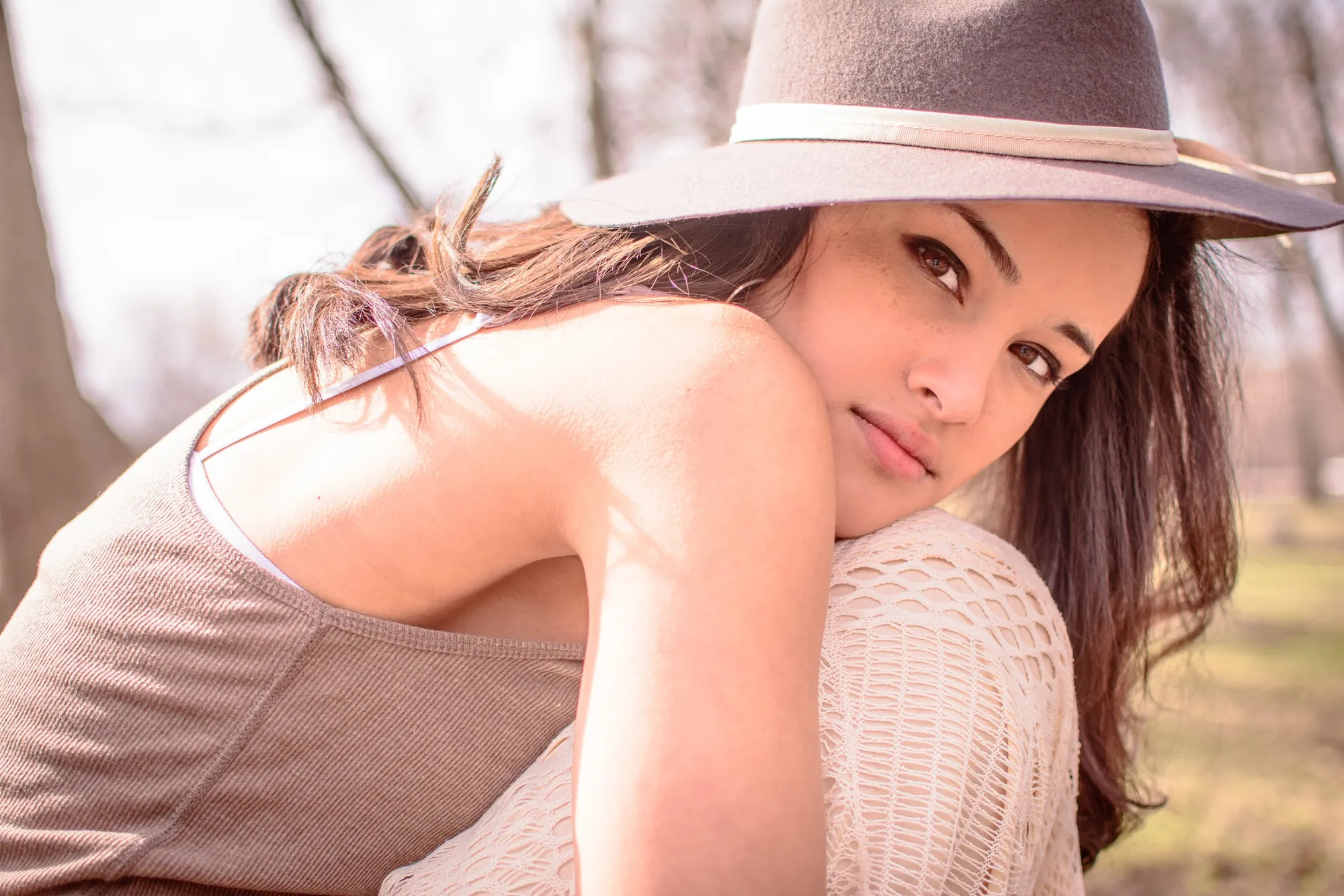 Spring senior pictures in the Cedar Valley, felt hat and soft sunlight