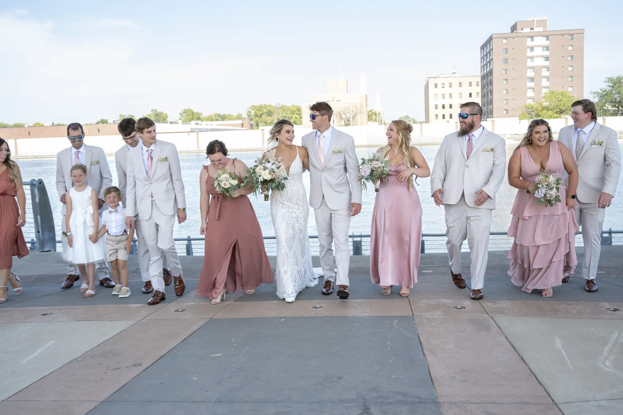 Wedding photography in Waterloo, wedding party walking along the riverfront