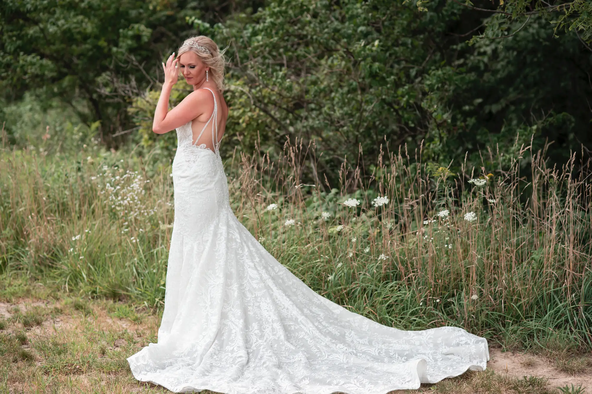 Bridal portrait in the Cedar Valley, lace gown with a long train